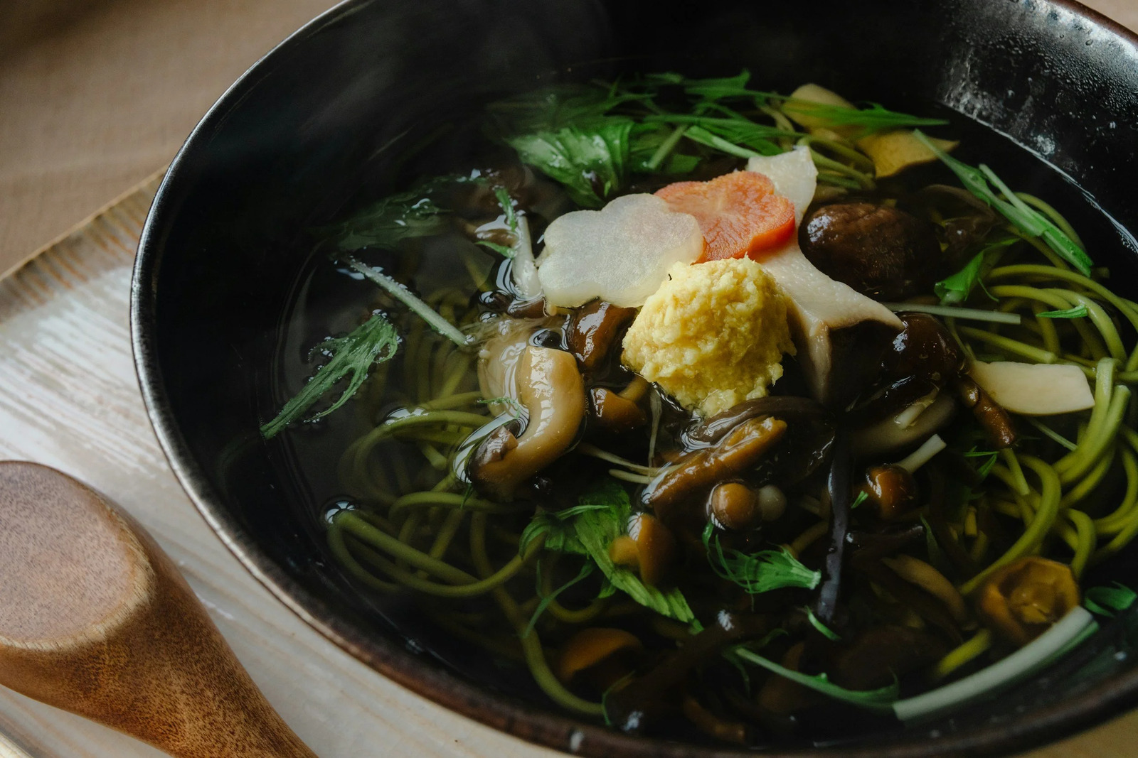A pan of greens, mushrooms and ginger