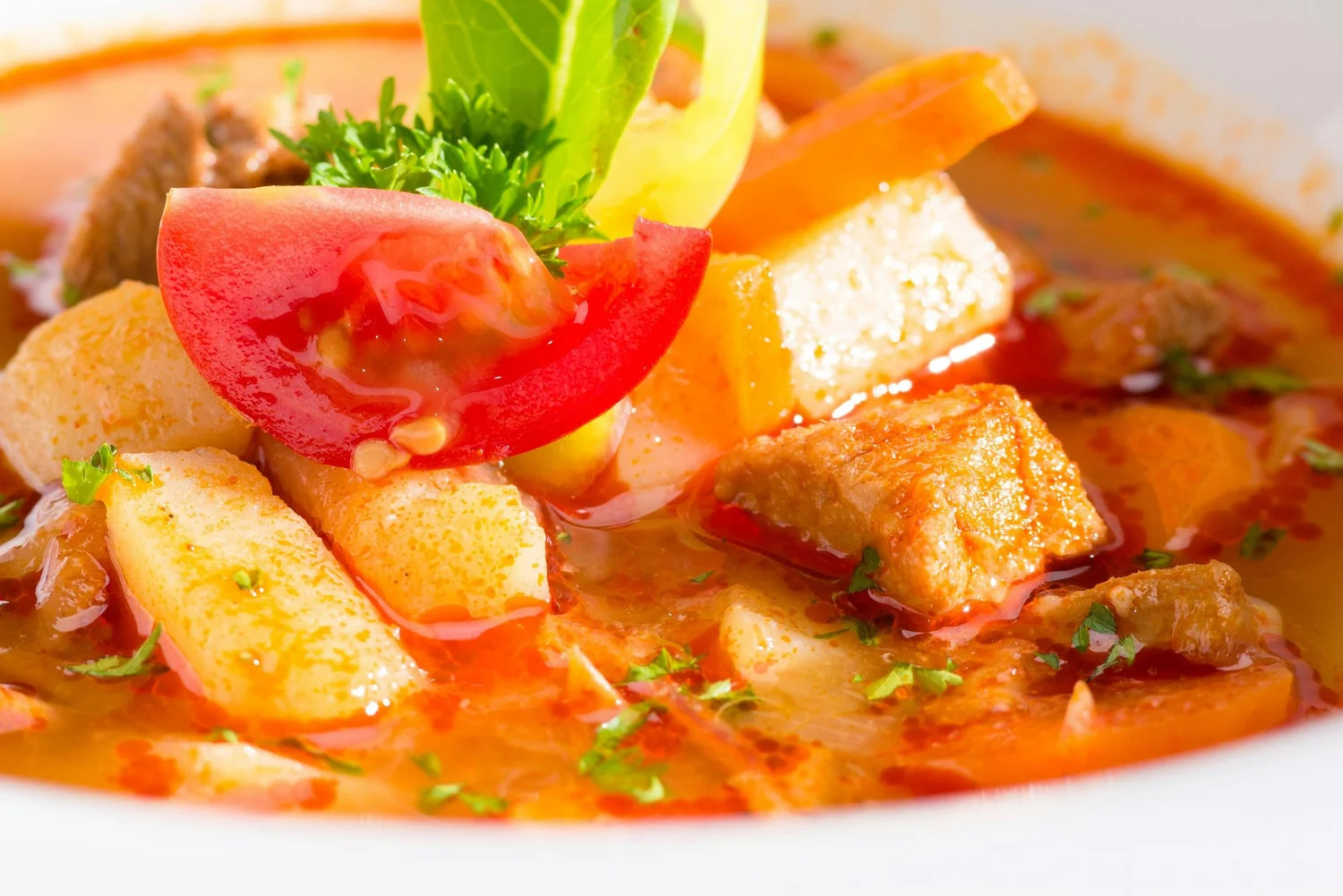 A bowl of vegetable and tomato soup