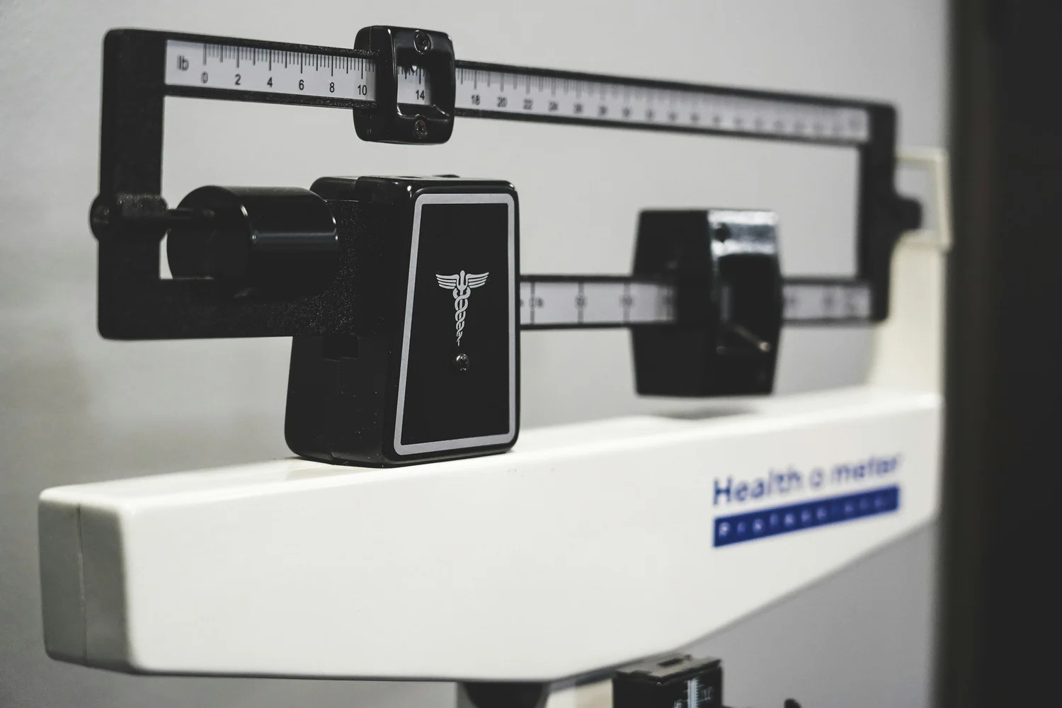 Close view of a balance beam weighing scale
